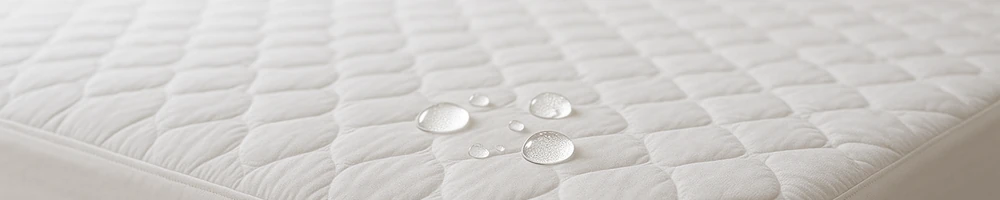 Protector de colchón impermeable y transpirable para cama